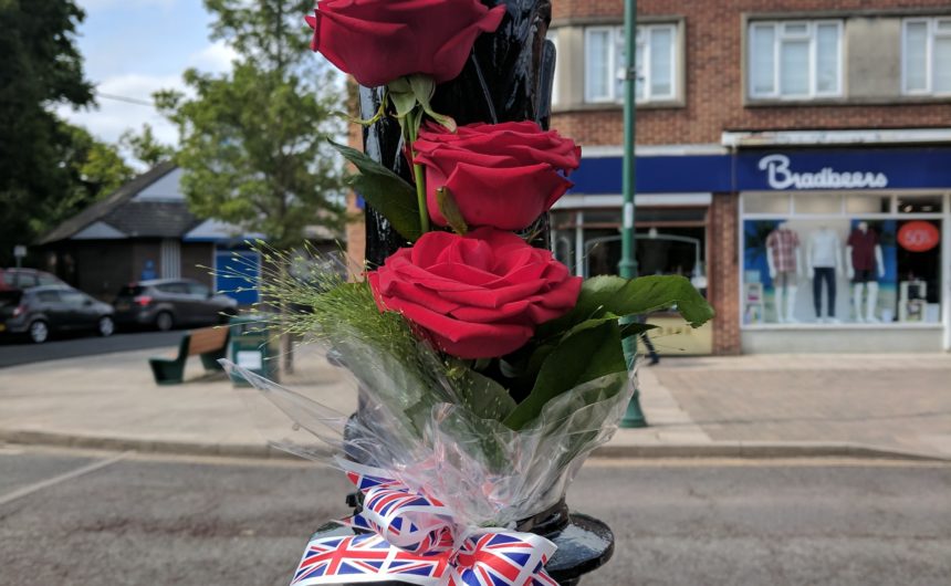 flower posy on memorial clock New Milton Remembers 81st Anniversary