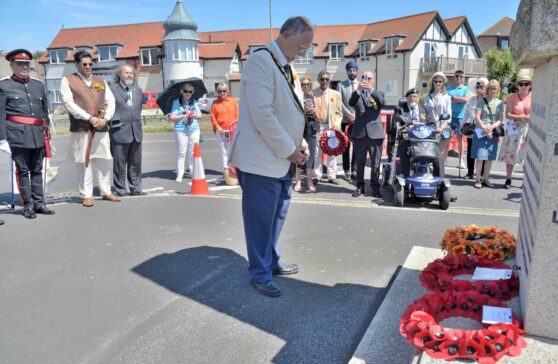 The Mayor with bowed head at the Indian Memorial