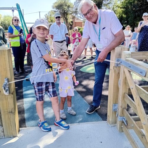 Cutting the ribbon at the official opening of Long Meadow Play Park