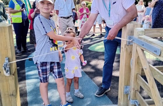 Cutting the ribbon at the official opening of Long Meadow Play Park