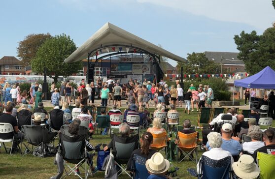 Crowds of people enjoying afternoon of live music